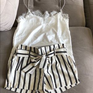 Black and white striped shorts with white lace top